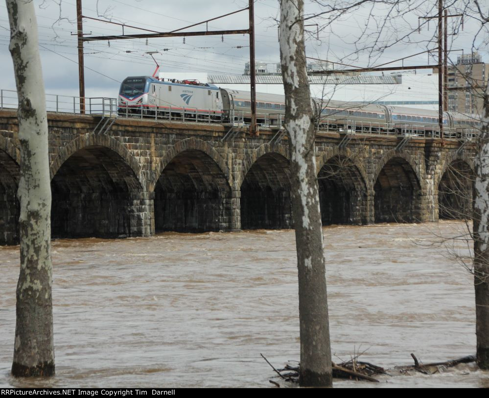 AMTK 645 on train 195 over a swollen Delaware River.